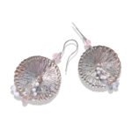 Large disc earrings in copper and silver with beads.
